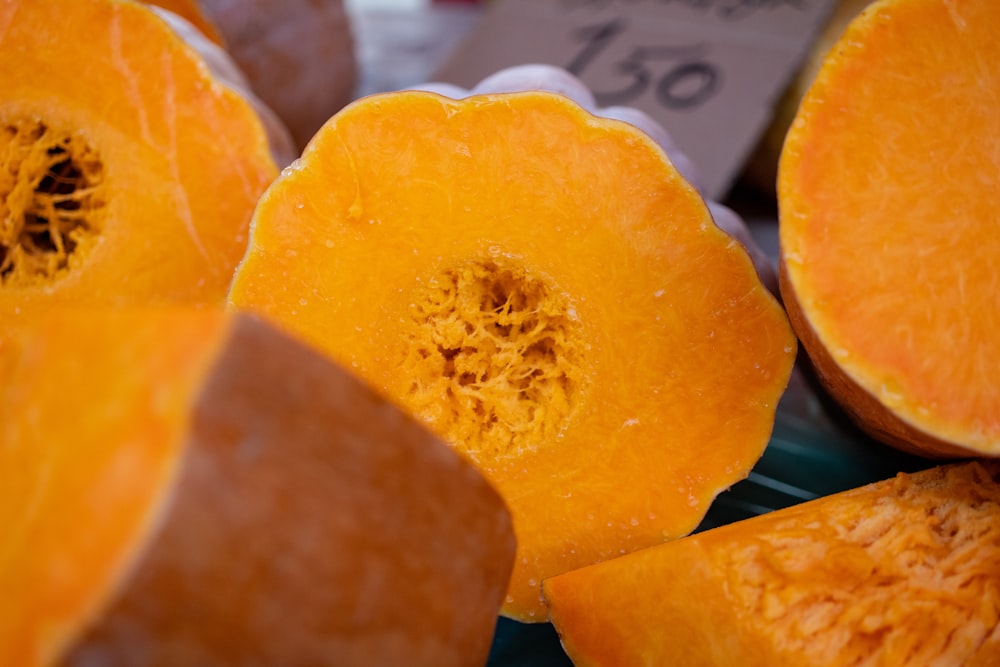 a pile of cut up pumpkins sitting on top of a table