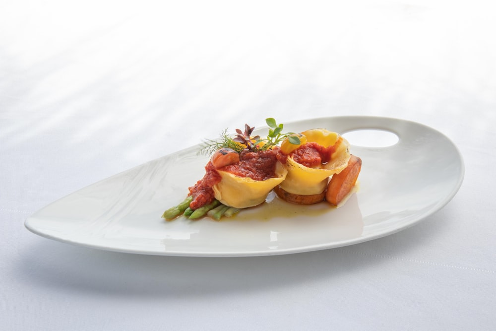 a white plate topped with food on top of a table