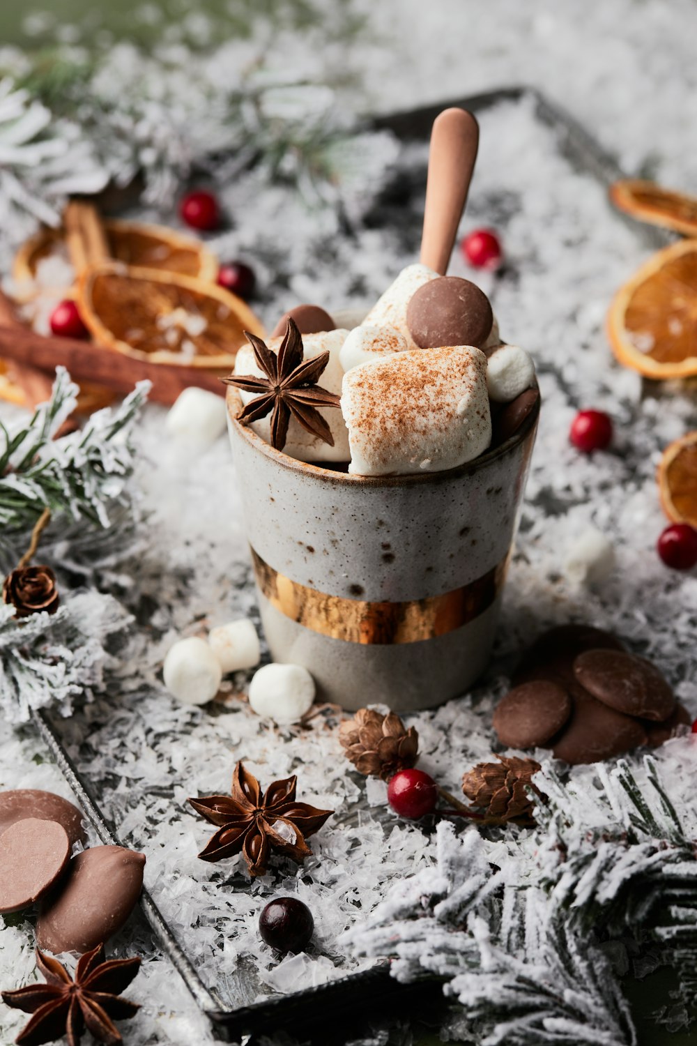 a cup of hot chocolate with marshmallows and spices