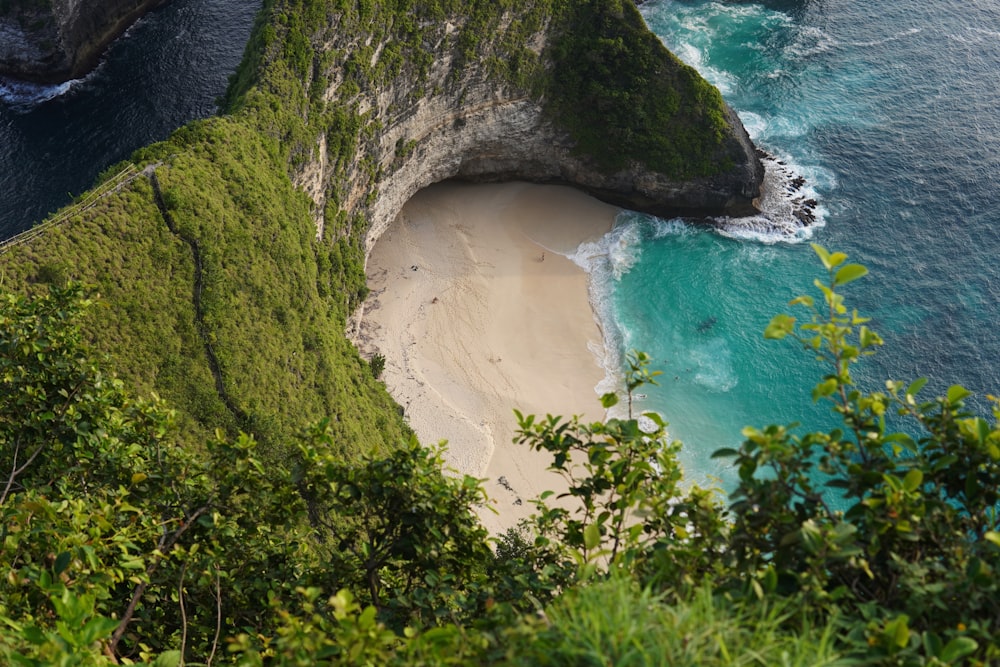 an aerial view of a beach and cliffs