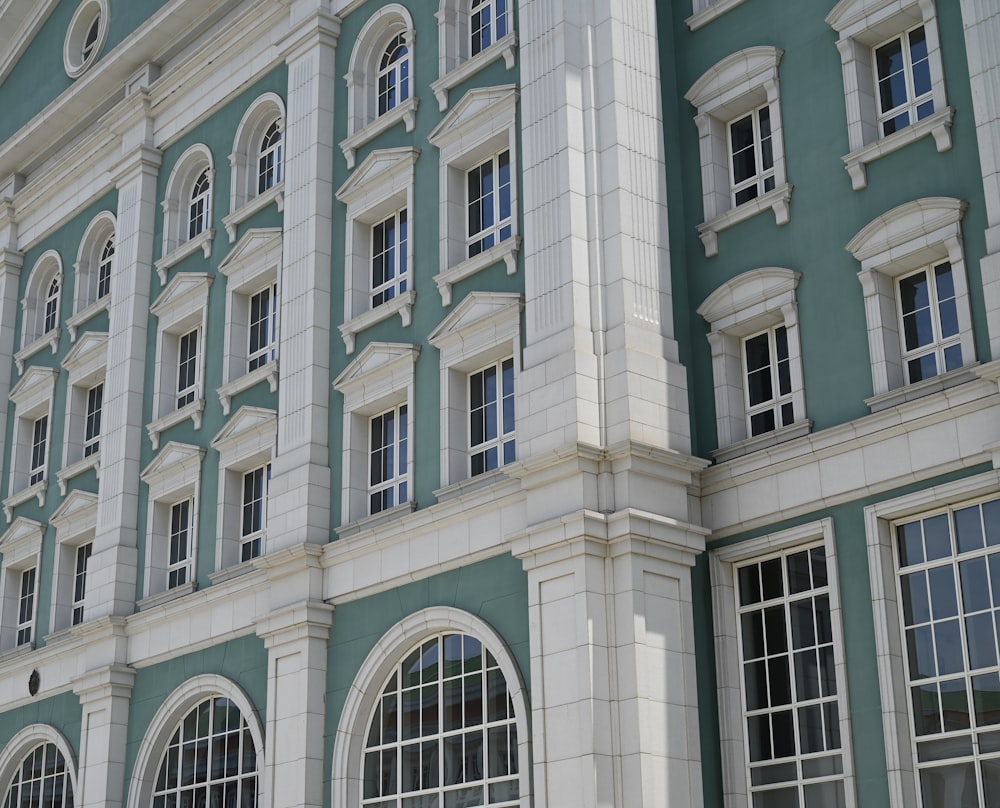 a large blue and white building with many windows