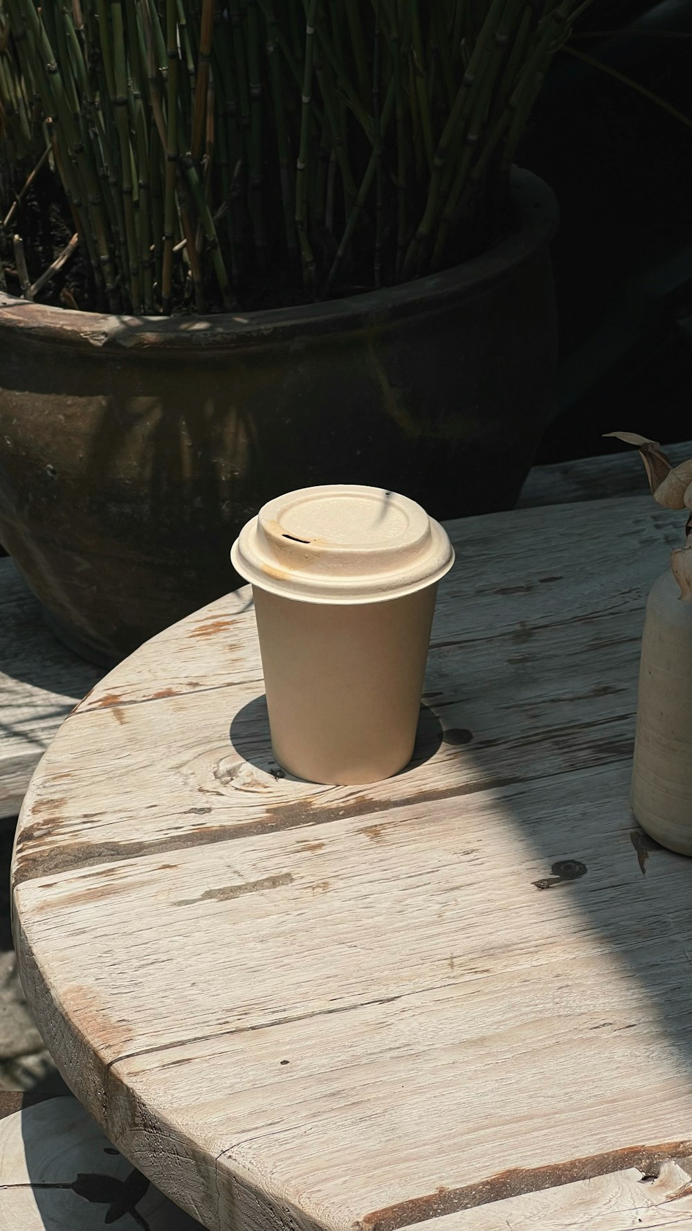 a coffee cup sitting on top of a wooden table