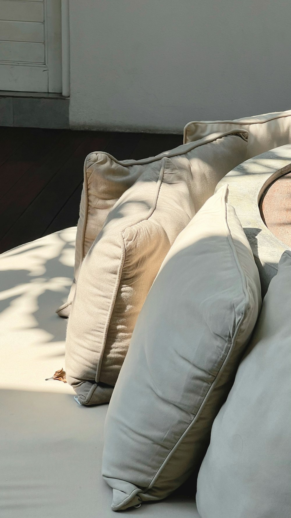 a bunch of pillows sitting on top of a bed