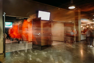 A virtual factory floor with interactive doors glowing softly inviting exploration.