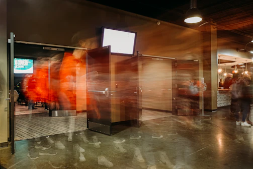 A virtual factory floor with interactive doors glowing softly inviting exploration.