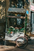 The Nomad Nosh cart decorated with seasonal flowers and rustic wooden accents, ready for a Pennsylvania event.
