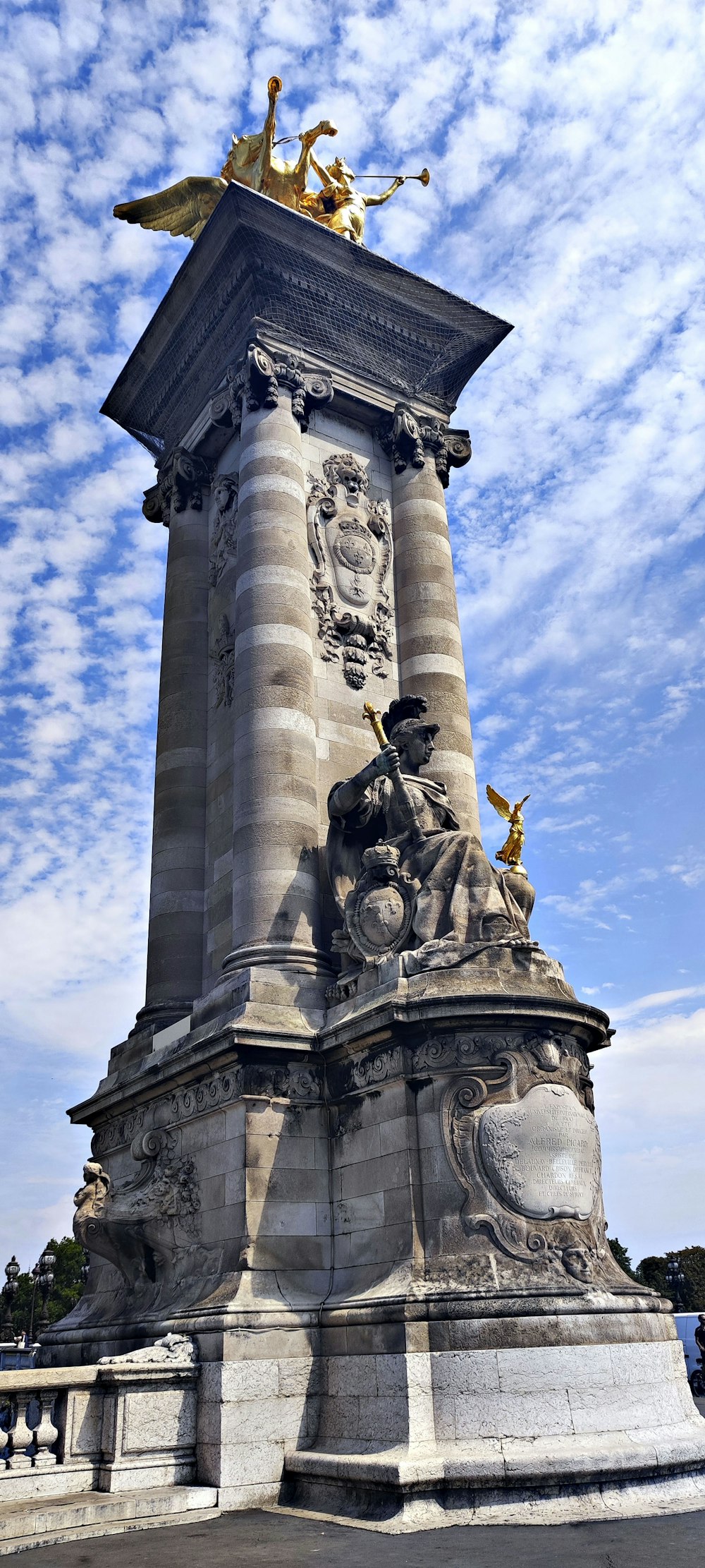 a statue with statues on top of it