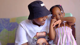 A mother and daughter sharing a joyful moment at a park, capturing a special friend date.