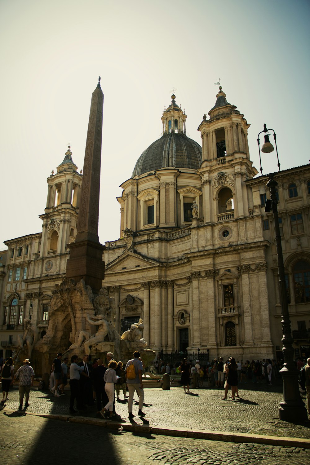 a group of people standing in front of a large building