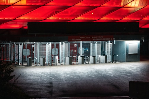Wide shot of an office lobby showing turnstiles with card access readers.