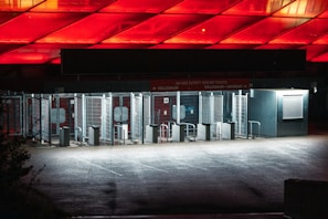 An outdoor entrance featuring multiple turnstiles.