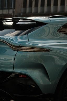 A sleek car adorned with glossy, weather-resistant vinyl decals reflecting sunlight.