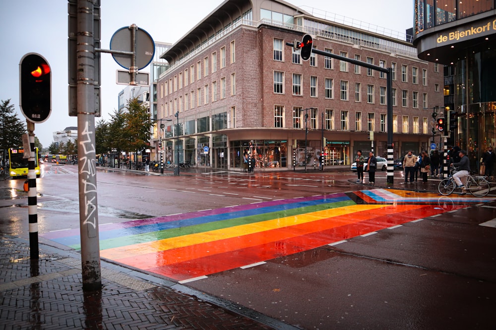 a rainbow painted crosswalk on a city street
