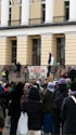 a group of people standing in front of a building