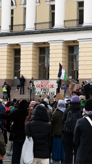 a group of people standing in front of a building