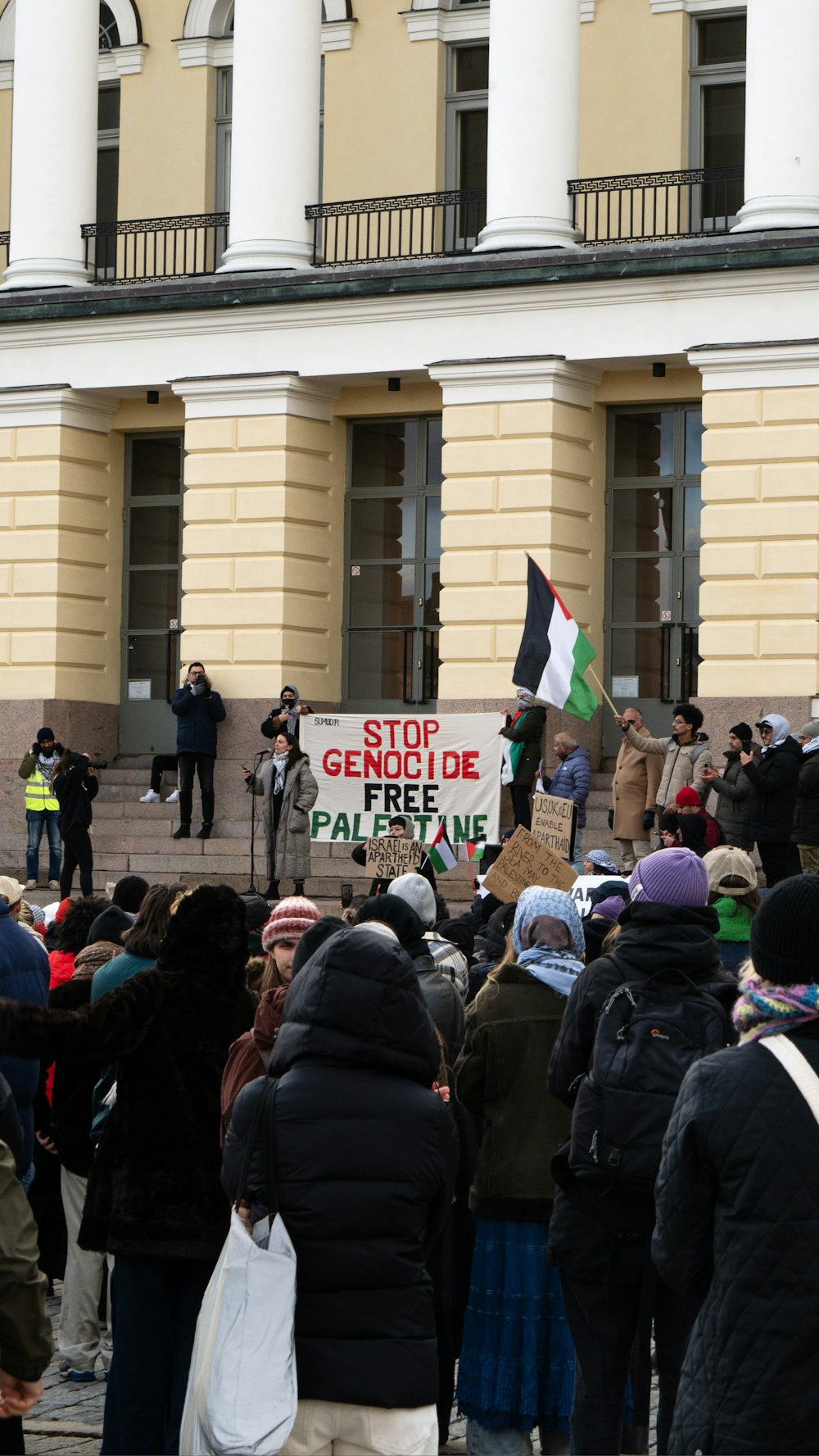 a group of people standing in front of a building