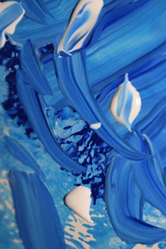 Abstract patterns blending midnight navy and pearl white in fluid motion.