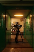 a camera set up on a tripod in a room