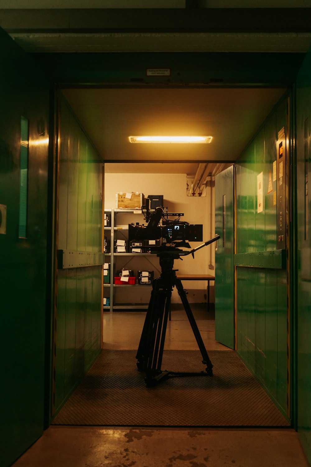 a camera set up on a tripod in a room