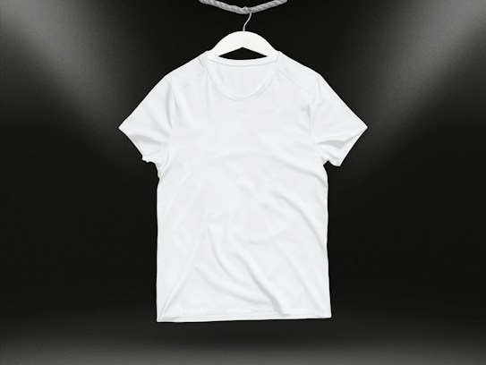 A plain white t-shirt on a hanger against a dark background. Soft lighting highlights the texture and folds of the fabric.