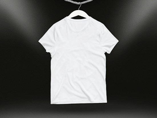 A plain white t-shirt on a hanger against a dark background. Soft lighting highlights the texture and folds of the fabric.
