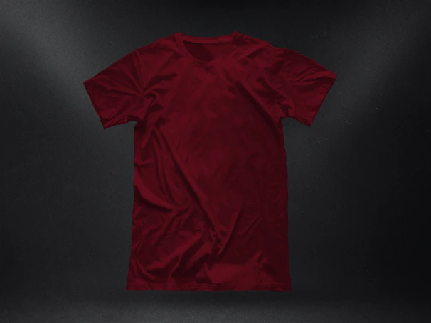 Close-up of a premium acid wash drop shoulder t-shirt laid out neatly on a wooden surface