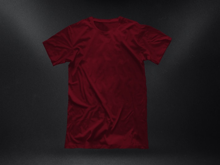 Close-up of a vibrant red tee with a clean, bold geometric print on soft fabric.