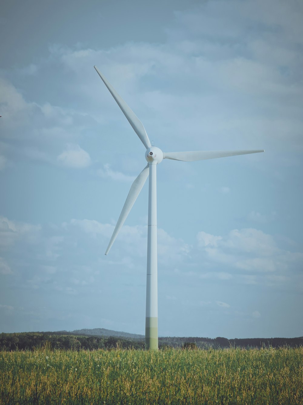 a wind turbine in the middle of a field