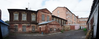 A wide-angle shot of the industrial building located in Hungary, showcasing its sturdy structure and surrounding yard.