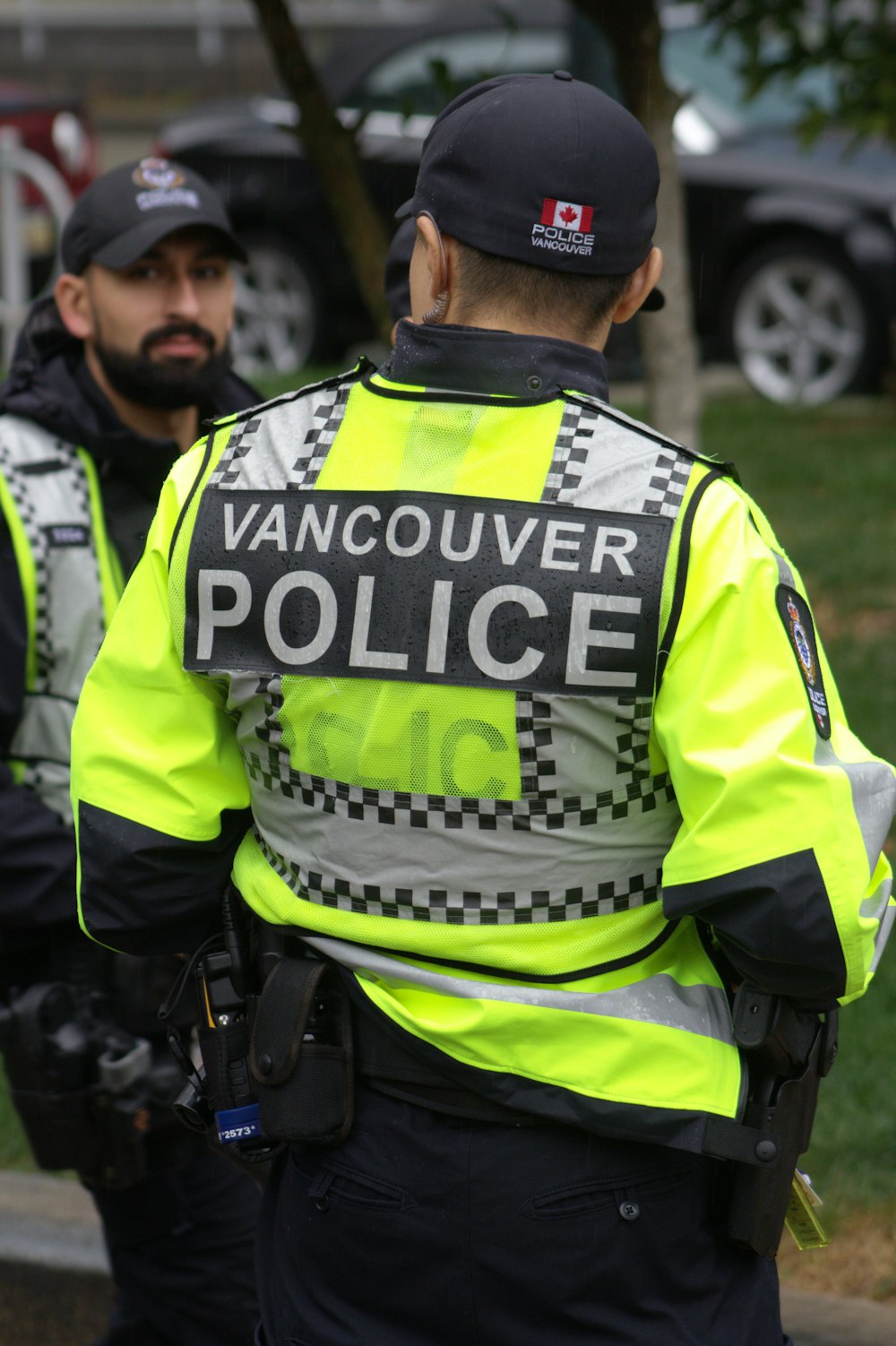 a couple of police officers standing next to each other