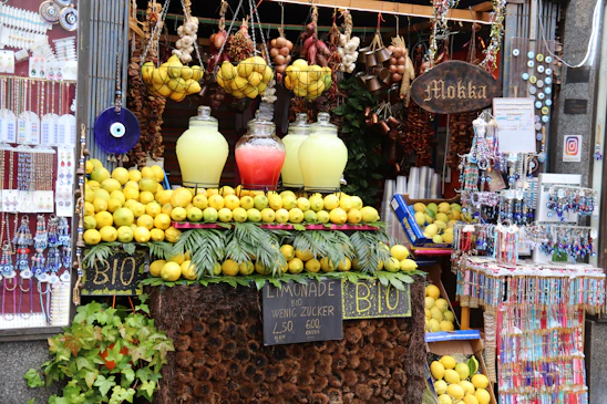 A vibrant marketplace with people using laptops and smartphones connected to lemon wi-fi's off-grid network.