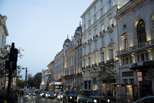 A stunning aerial view of a bustling London street lined with elegant period buildings in prime zones 1 to 3.