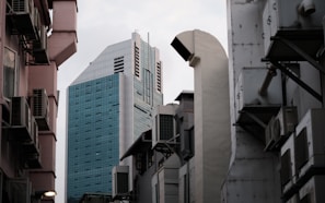 a city street with tall buildings in the background
