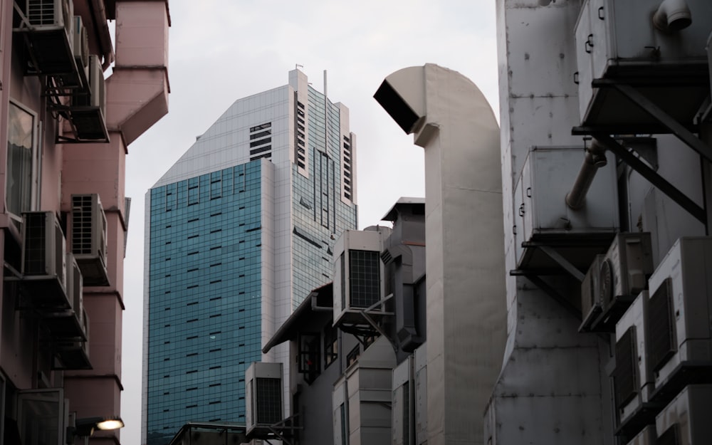 a city street with tall buildings in the background