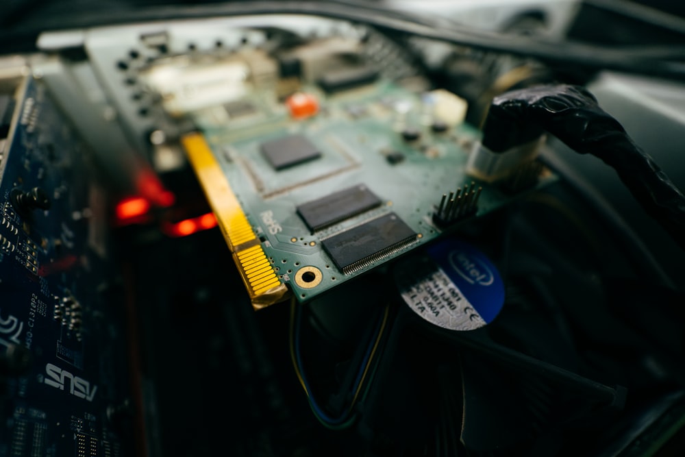 a close up of a computer motherboard with wires