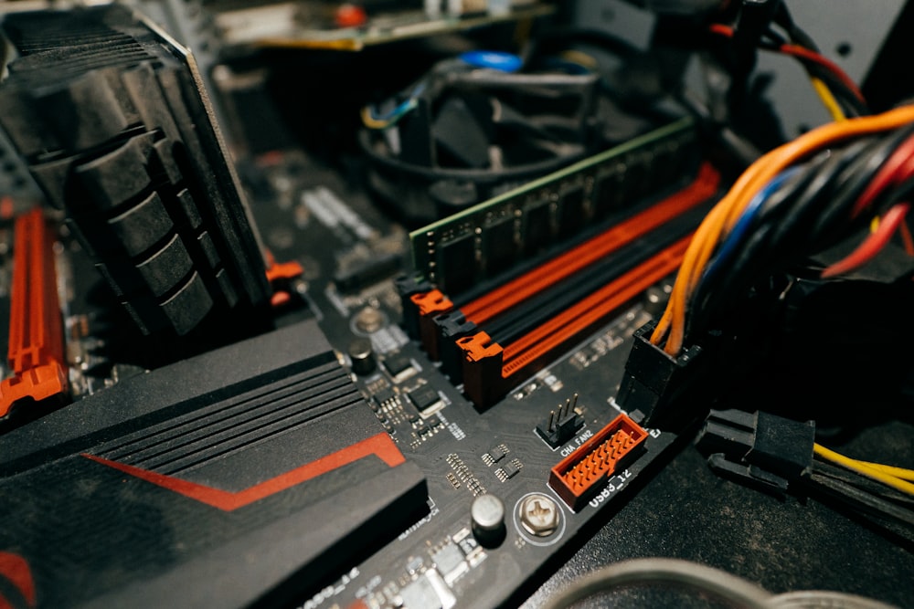 a close up of a computer motherboard with wires