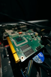 a close up of a computer motherboard with wires