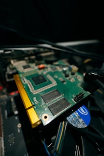 a close up of a computer motherboard with wires