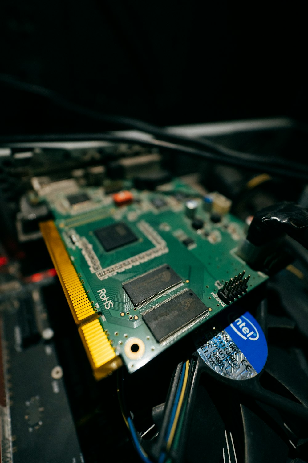 a close up of a computer motherboard with wires