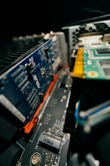 the motherboard of a laptop is being removed