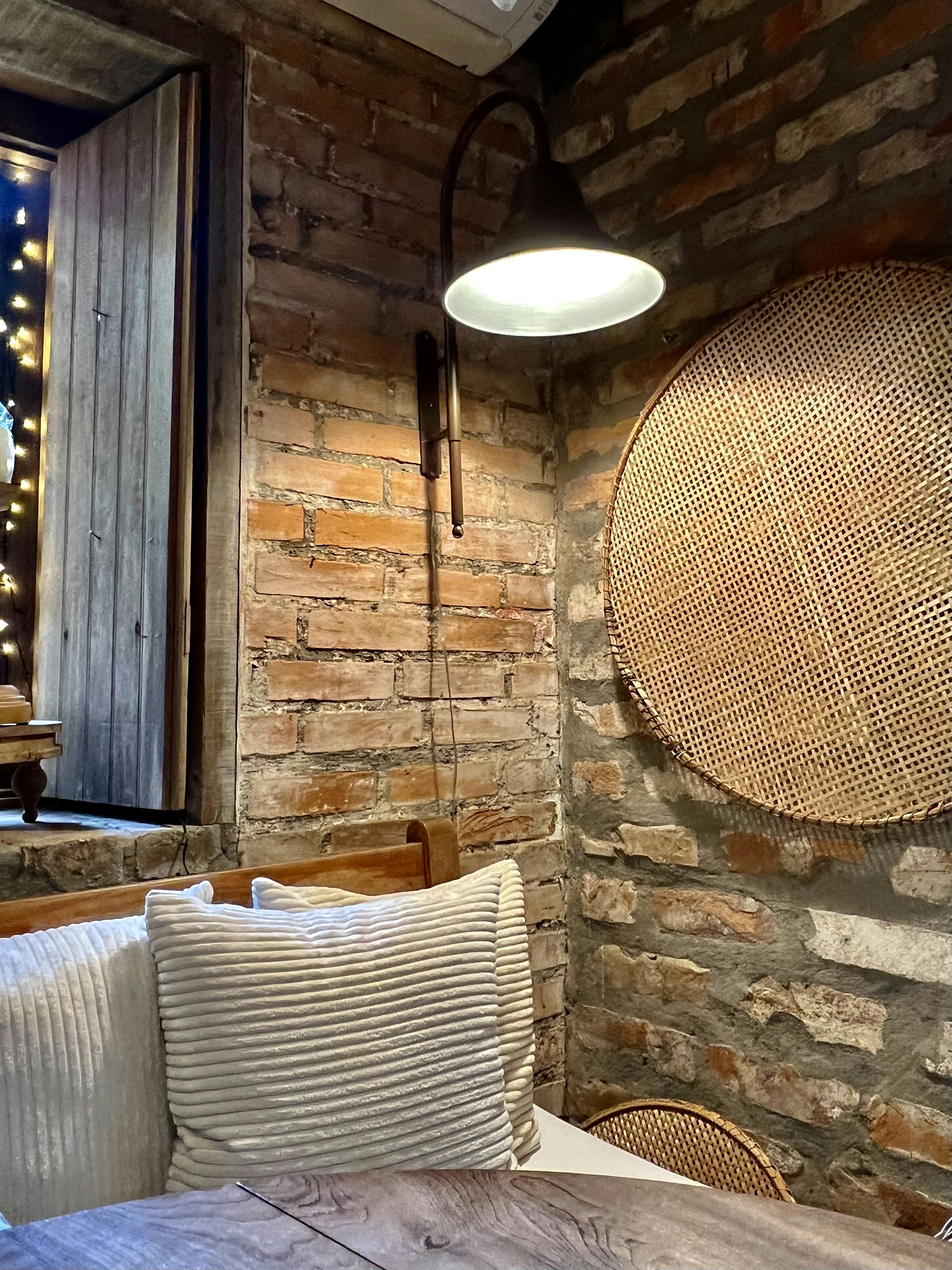 Cozy corner with linen accent chair beside a small side table