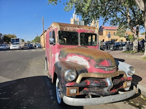 Delivery vehicle parked outside a hotel, ready to pick up laundry bags.