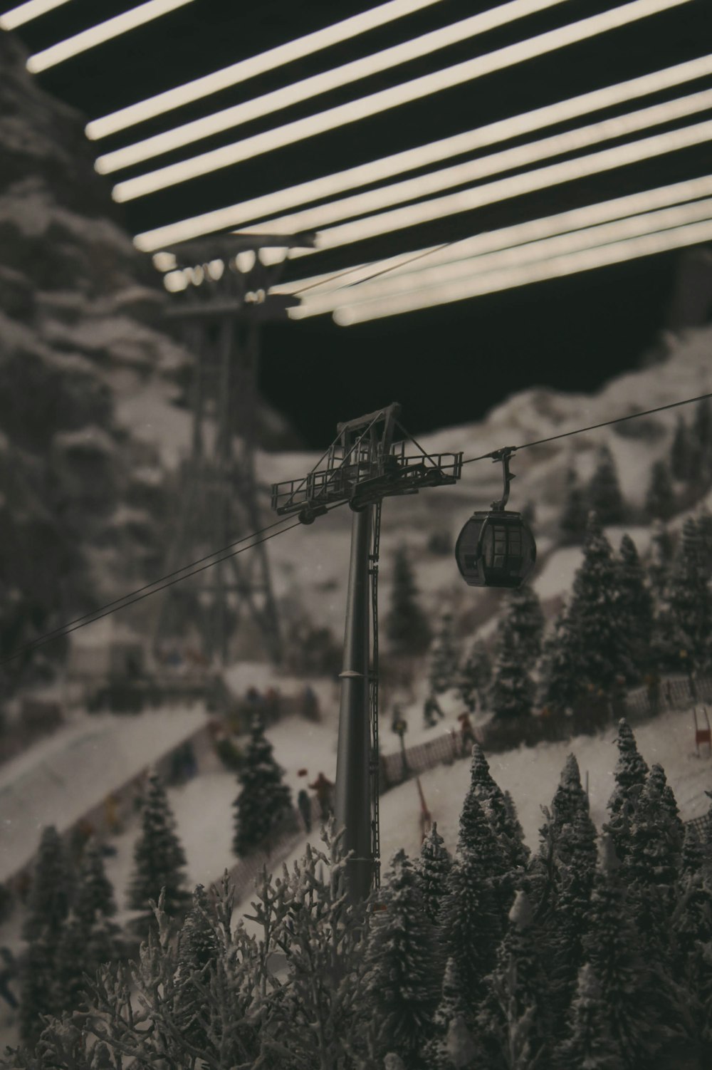 a ski lift going up a snowy mountain