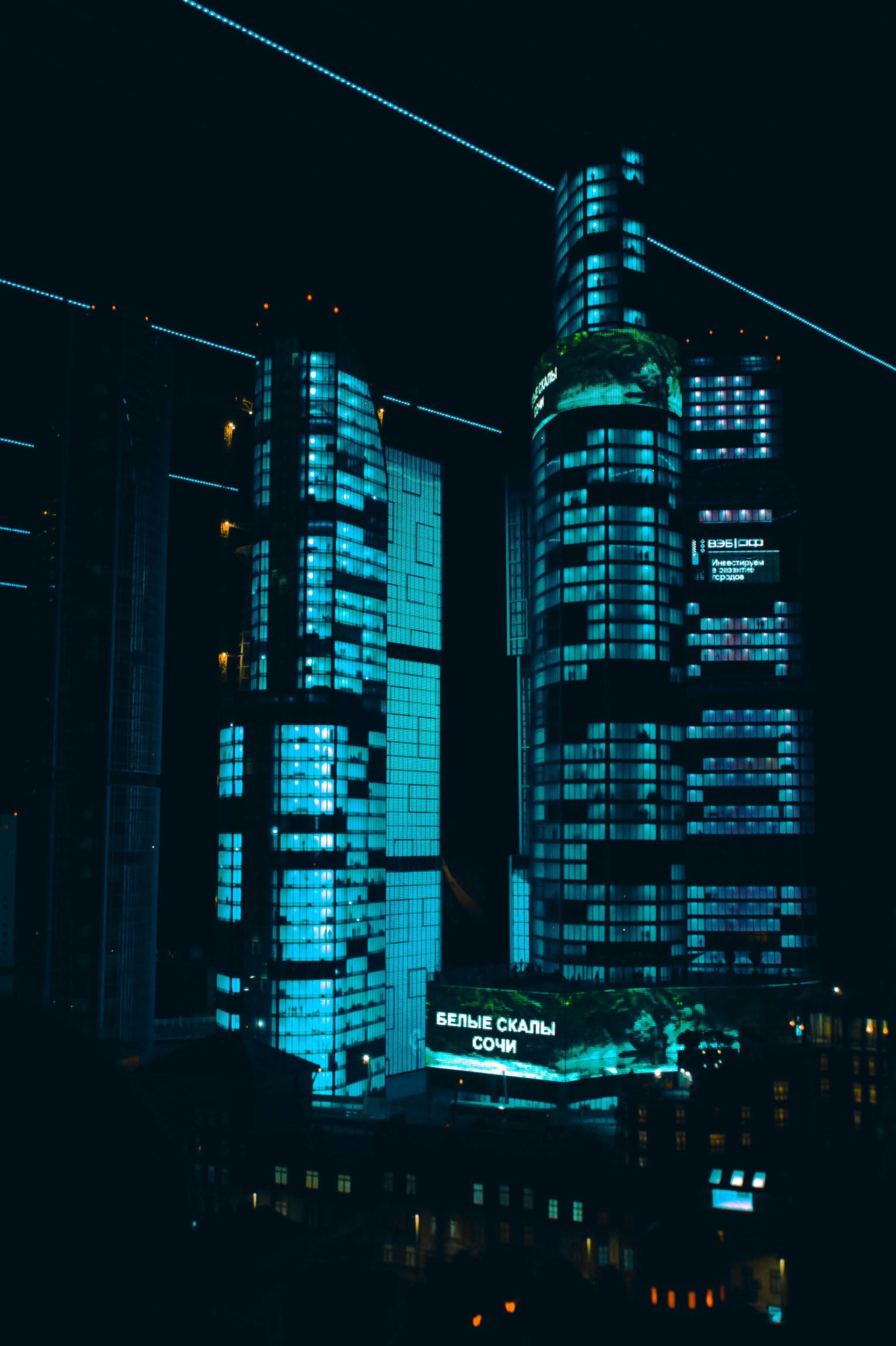 a couple of tall buildings sitting next to each other