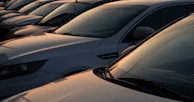 A row of freshly washed cars gleaming under the sun at our Ramapuram location.