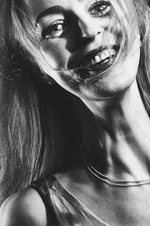 A detailed acrylic portrait capturing the subtle expressions of a smiling young woman.