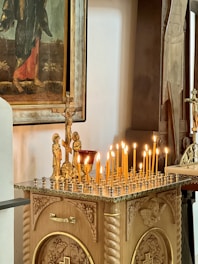 A close-up of a beautifully crafted Coptic icon on a wooden altar.