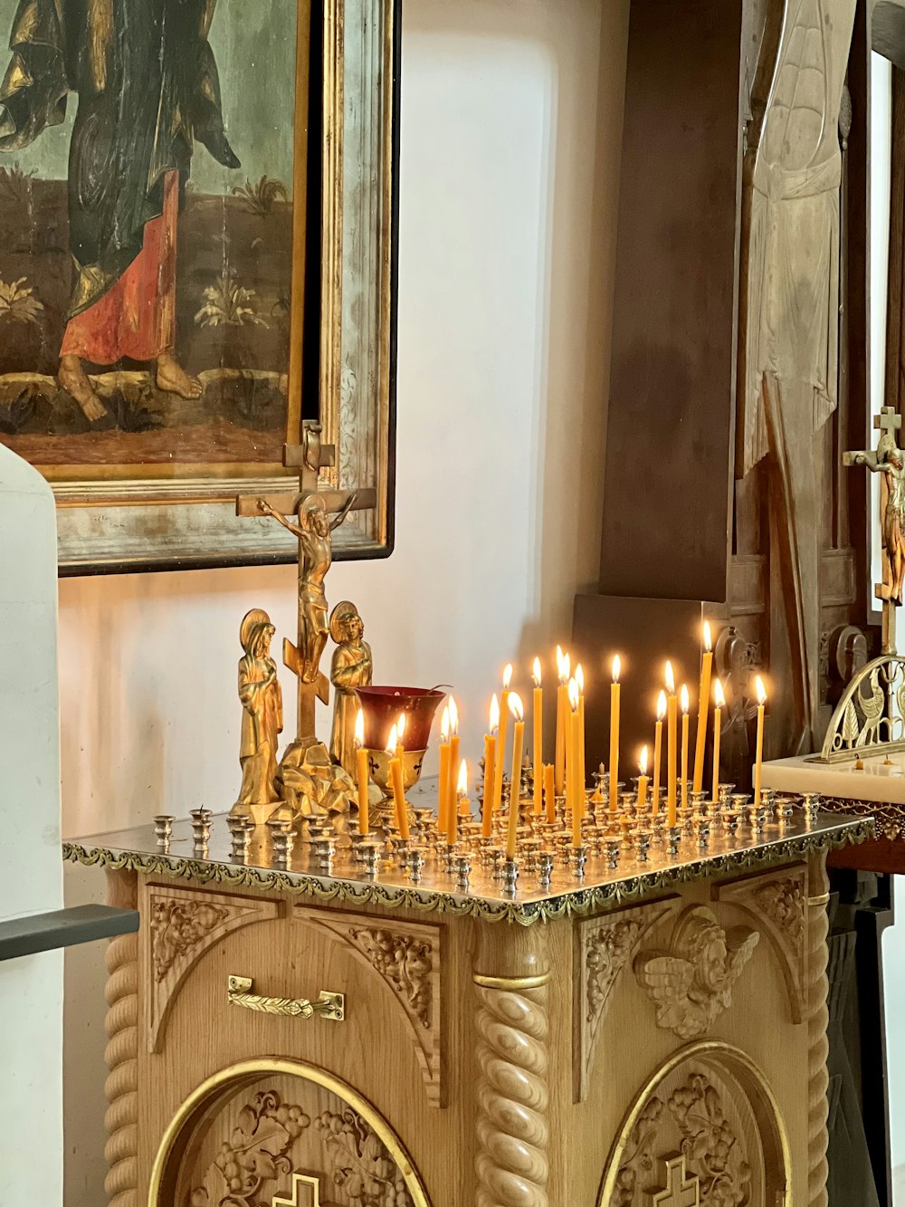 a table with a bunch of candles on top of it