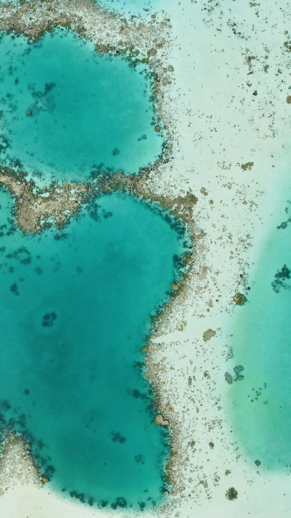 an aerial view of a body of water surrounded by land