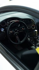 Close-up of a car dashboard showing sport mode activation.